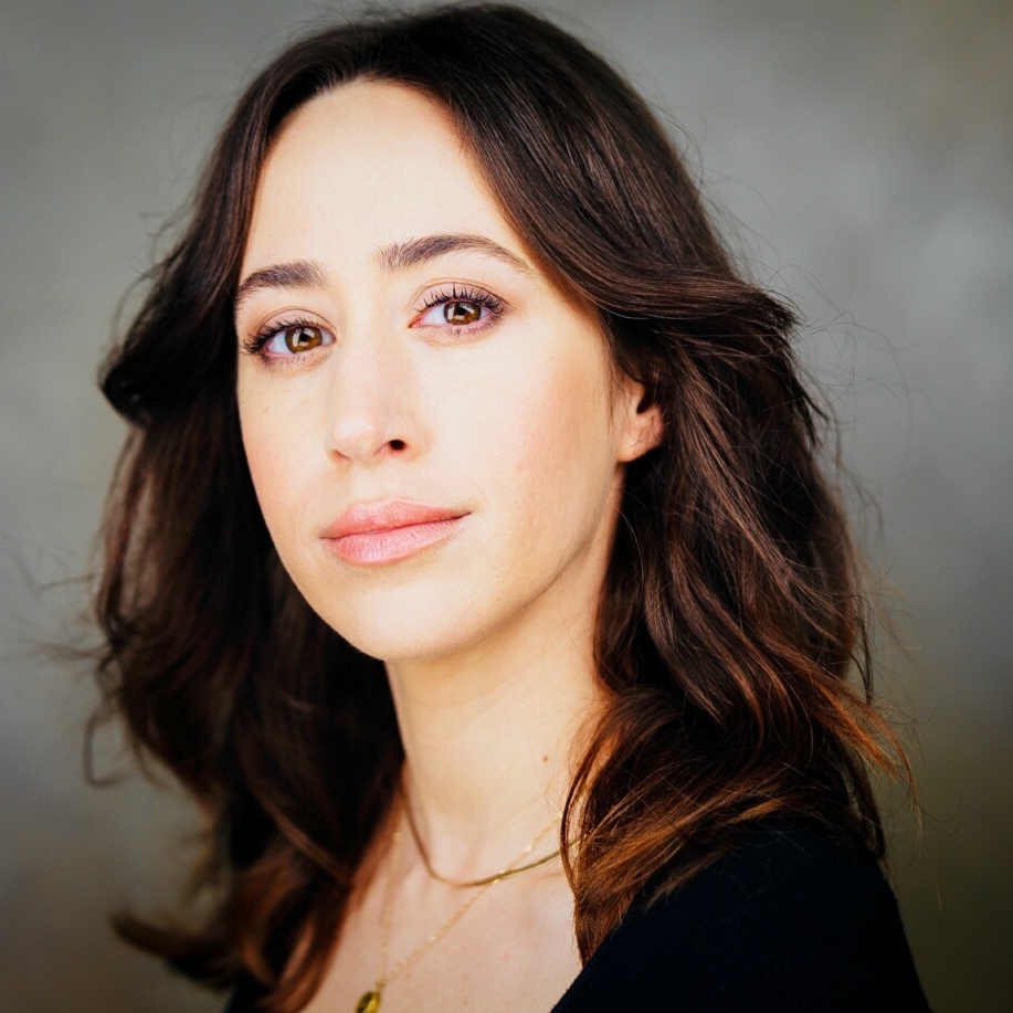 Jessica Duby's headshot, she has long brown hair and looks toward the camera. 